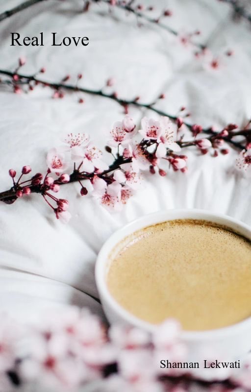 Cup of coffe on the bed.